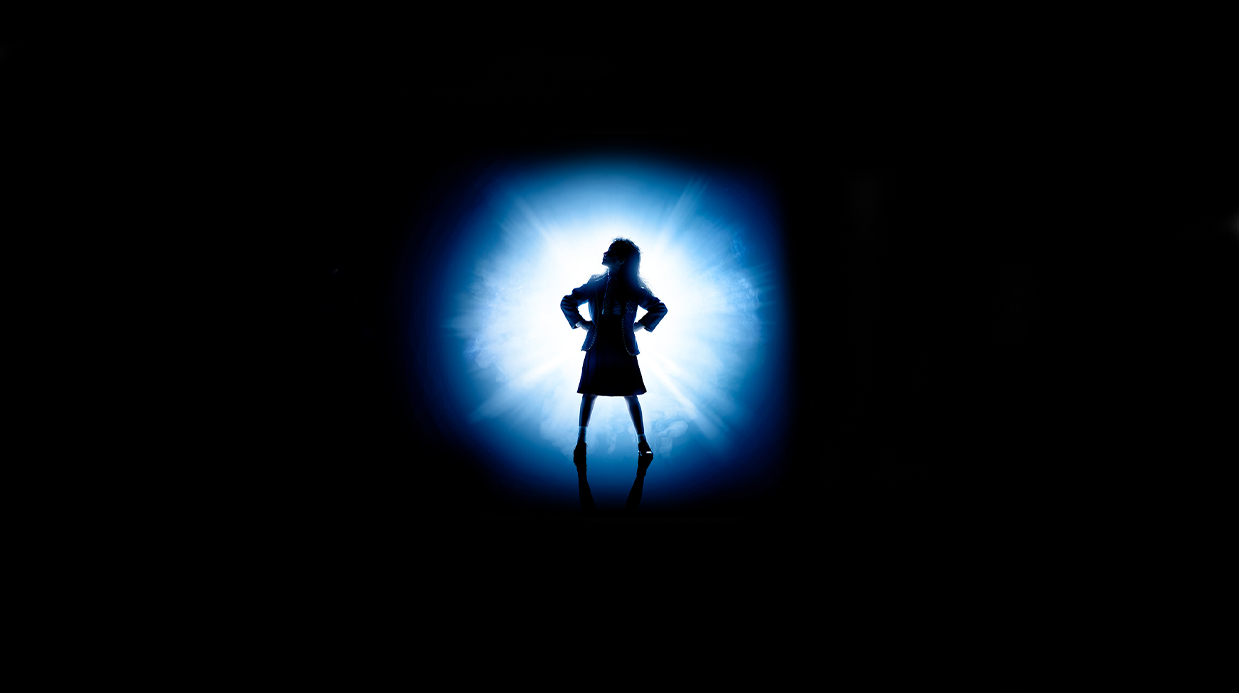 Artwork for Matilda Jr featuring a silhouette of a girl against a blue radial light.